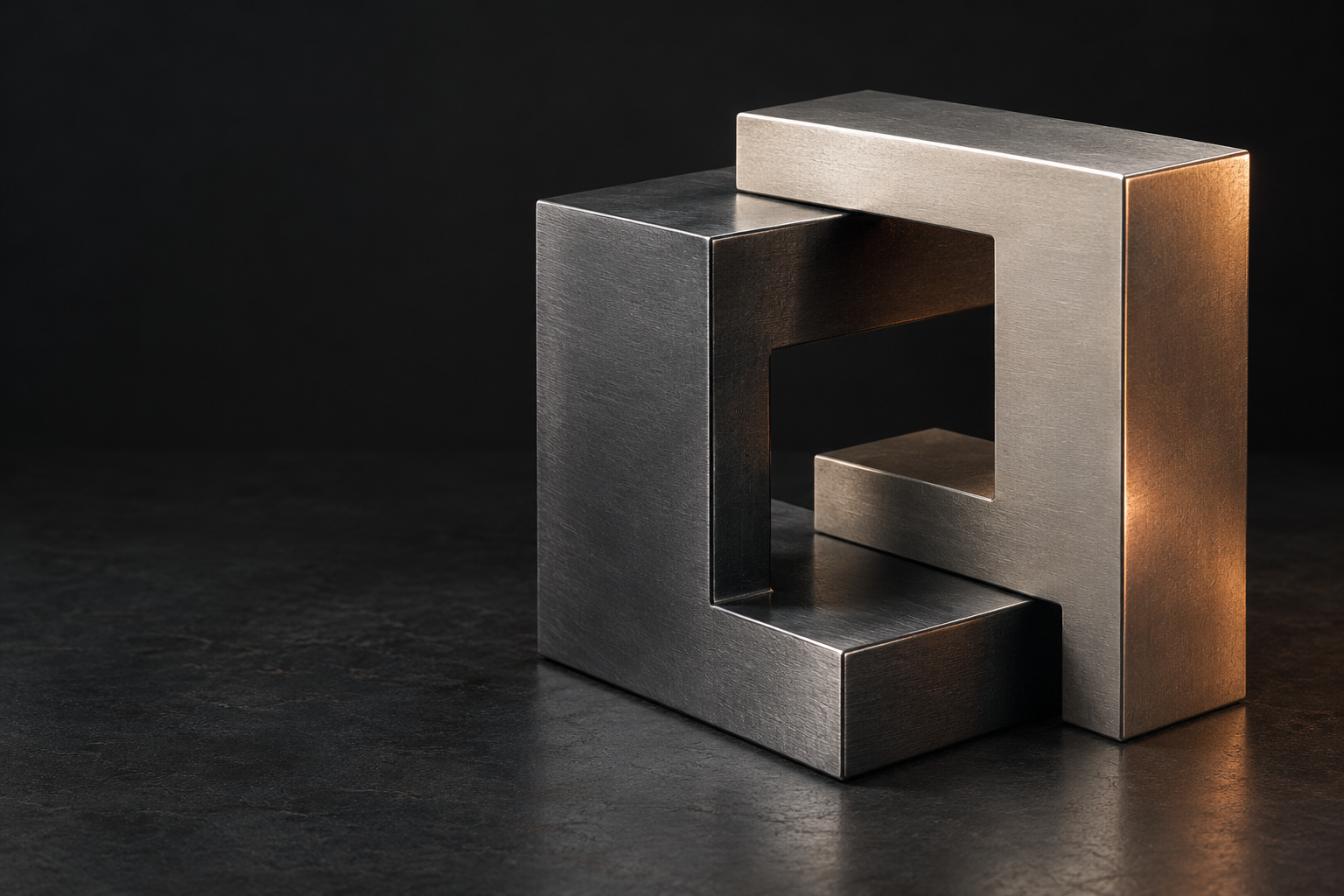 Two precisely fitted metal forms in a quiet studio composition